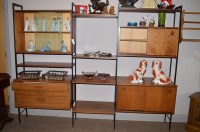 Lot 737 - An Avalon stacking unit, teak on black painted...