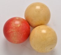 Lot 416 - Three 19th Century ivory billiard balls, two...