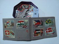 Lot 238 - An album of A & BC flags cards; together with...