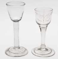 Lot 330 - Two plain stem wine or cordial glasses, folded...