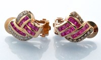 Lot 705 - A pair of ruby and diamond earrings, set with...