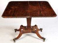 Lot 1197 - A fine Regency rosewood turn over top tea...