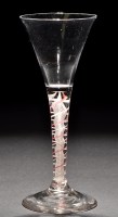 Lot 656 - Drawn trumpet bowl colour twist wine glass,...