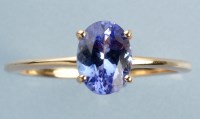 Lot 1001 - A tanzanite ring, the oval facet-cut tanzanite...