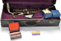 Lot 396 - An early 20th Century alto-sax, stamped '10390'...