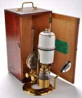 Lot 403 - An early 20th Century opticians lamp, by...
