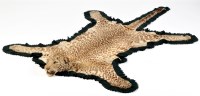 Lot 424 - A taxidermy mounted cheetah skin rug, by Van...