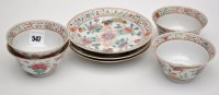 Lot 547 - Set of four famille tea bowls and three...