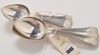 Lot 1049 - Six George V table spoons and six matching...