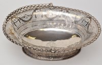Lot 1117 - A George III pierced oval basket, London 1771,...