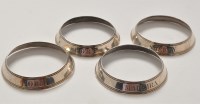 Lot 1146 - Four 19th Century white metal wine collars,...
