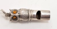 Lot 1149 - An Edwardian silver owl pattern whistle, by...