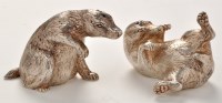 Lot 1155 - A pair of white metal badger pattern...