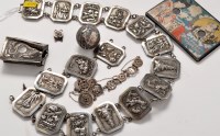 Lot 1157 - A Chinese white metal sixteen panel embossed...