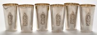 Lot 1164 - A set of six Thai white metal beakers, stamped...