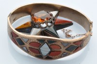Lot 1199 - A 19th Century Scottish hardstone set bangle,...