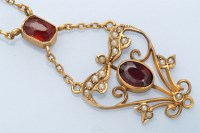 Lot 1261 - An Edwardian garnet and seed pearl set...
