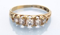 Lot 1281 - A five stone diamond ring, set with graduated...