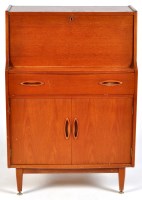 Lot 19 - A mid 20th Century teak bureau, the fall-flap...