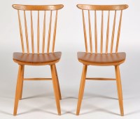 Lot 24 - Two Danish style beech wood stick back dining...