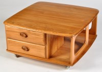 Lot 67 - An Ercol light elm ''Pandora'' style coffee...