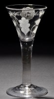 Lot 217 - A rare Jacobite wine glass, the drawn trumpet...