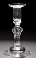 Lot 254 - An impressive candlestick, the pan top sconce...