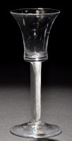 Lot 269 - A waisted bucket bowl wine glass, raised on a...