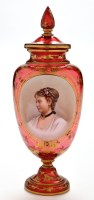 Lot 318 - Bohemian cranberry glass vase and cover, with...