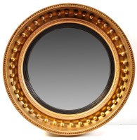 Lot 979 - A Regency giltwood and gesso convex wall...