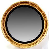 Lot 1110 - A Regency giltwood convex wall mirror, the...