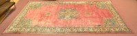 Lot 986 - A large Turkish Ushak carpet, the central...
