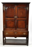 Lot 1125 - A mid 18th Century oak cupboard, the flared...