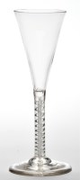 Lot 26 - Mixed twist wine flute, the trumpet bowl above...