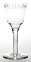 Lot 37 - Incised twist wine glass, the ogee bowl with...
