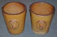 Lot 74 - A near pair of salt glaze plant pots, of North...