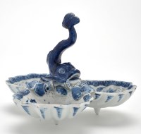 Lot 100 - Blue and white dolphin shell pickle stand, the...