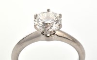 Lot 868 - Tiffany & Co: a single stone diamond ring, the...