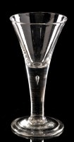 Lot 951 - Drawn plain stem wine glass, the trumpet bowl...