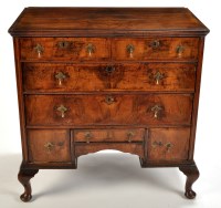 Lot 1406 - A walnut chest, with two short and two long...