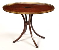 Lot 1411 - A Regency period oval-shaped tip-up-top...