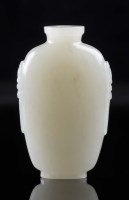 Lot 1036 - A pale celadon/white jade snuff bottle, of...