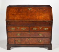 Lot 1301 - A mid 18th Century walnut bureau, with feather...