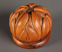 Lot 83 - A carved vegetable ivory pomander in the form...