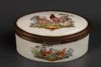 Lot 125 - An oval Berlin porcelain box with gilt metal...