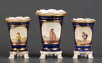 Lot 143 - A garniture of three vases, circa 1830,...