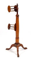 Lot 1378 - A Georgian mahogany wool winder of tripod form,...