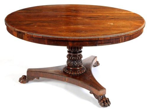 Lot 1180 - A Regency rosewood circular-shaped tip-up-top...