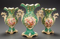 Lot 384 - A garniture of three porcelain vases, circa...