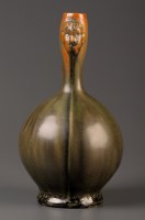 Lot 390 - An Adamesk 'mask' jug by Moses J Adams,...